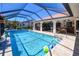 Enjoy the Florida lifestyle with this private caged pool and spacious outdoor area, perfect for entertaining guests at 815 Via Formia, Punta Gorda, FL 33950