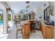 Wet bar area with seating, perfect for entertaining guests at 815 Via Formia, Punta Gorda, FL 33950