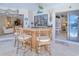 Wet bar with stools, providing an ideal entertaining space at 815 Via Formia, Punta Gorda, FL 33950