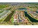 An aerial view of a home located on a cul-de-sac with a large body of water at 9020 Eagle Bay Ct, North Port, FL 34287