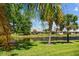 A beautiful backyard with lush greenery overlooking a peaceful pond at 9020 Eagle Bay Ct, North Port, FL 34287