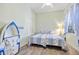 Bedroom features twin beds, unique decor, and hardwood floors at 9020 Eagle Bay Ct, North Port, FL 34287