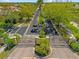 Community entrance gate with palm trees and lush landscaping at 9020 Eagle Bay Ct, North Port, FL 34287