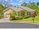 Charming single-story home with a well-maintained lawn and inviting curb appeal on a sunny day at 9020 Eagle Bay Ct, North Port, FL 34287