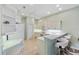 Well-lit kitchen with white cabinets, a breakfast bar, and modern appliances offering a clean design at 9020 Eagle Bay Ct, North Port, FL 34287