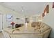 Bright living room with a spacious layout, connecting seamlessly to the kitchen and dining areas at 9020 Eagle Bay Ct, North Port, FL 34287