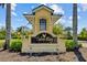 Community sign reads: Talon Bay, surrounded by lush landscaping and foliage at 9020 Eagle Bay Ct, North Port, FL 34287