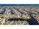 High angle aerial view of canal-front home in a quiet residential neighborhood near the water at 1206 Winward Ct, Punta Gorda, FL 33950