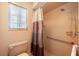 Full bathroom featuring a shower stall with grab bar, privacy curtain, and neutral wall color at 1206 Winward Ct, Punta Gorda, FL 33950
