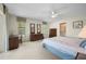 Bright bedroom with ample natural light, featuring a ceiling fan and neutral carpeting at 1206 Winward Ct, Punta Gorda, FL 33950