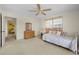 Comfortable bedroom features a daybed, ceiling fan, and bright natural light at 1206 Winward Ct, Punta Gorda, FL 33950