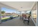 Relaxing screened lanai features water view with comfortable outdoor seating at 1206 Winward Ct, Punta Gorda, FL 33950