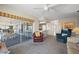 Inviting living room with access to screened in lanai, kitchen and pass through to a service area or dining area at 1206 Winward Ct, Punta Gorda, FL 33950