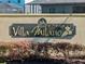 Villa Milano community sign surrounded by landscaped bushes at 15288 Mille Fiore Blvd, Port Charlotte, FL 33953