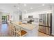 Bright, open kitchen boasts stainless appliances, granite countertops and a large island with seating at 15288 Mille Fiore Blvd, Port Charlotte, FL 33953