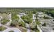 Discover this secluded home, featuring a circular driveway, surrounded by lush greenery from above at 16180 Forest Glen Ct, Punta Gorda, FL 33982