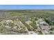Sprawling estate nestled within lush greenery offers a circular driveway and a serene, private setting at 16180 Forest Glen Ct, Punta Gorda, FL 33982