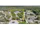 Sprawling property boasts a long driveway leading to a charming home surrounded by lush trees and expansive land at 16180 Forest Glen Ct, Punta Gorda, FL 33982