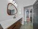 Modern bathroom featuring a wood vanity with stone countertop at 16180 Forest Glen Ct, Punta Gorda, FL 33982