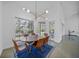 Bright dining room with large windows, stylish lighting, and modern furnishings at 16180 Forest Glen Ct, Punta Gorda, FL 33982