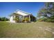 Charming home featuring lush landscaping and a sprawling lawn at 16180 Forest Glen Ct, Punta Gorda, FL 33982
