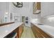 Stylish kitchen featuring white cabinetry, a large island, and modern stainless steel appliances at 16180 Forest Glen Ct, Punta Gorda, FL 33982