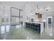 Open-concept kitchen featuring a large island with seating, modern cabinetry, and sleek stainless steel appliances at 16180 Forest Glen Ct, Punta Gorda, FL 33982
