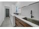 Well-lit laundry room with modern appliances, counter space, and ample storage at 16180 Forest Glen Ct, Punta Gorda, FL 33982
