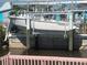 Boat on lift offers convenient access to waterways, perfect for boating enthusiasts at 2061 S Pine St, Englewood, FL 34224