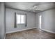 Bright bedroom with tile floors, ceiling fan and windows with lots of natural light at 234 Tait Se Ter, Port Charlotte, FL 33952