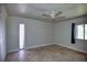 This bedroom features tiled floors, multiple windows for natural light and a spacious closet at 234 Tait Se Ter, Port Charlotte, FL 33952