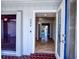 Inviting entryway features tiled floors, decorative door, and pool view, creating a warm and stylish welcome at 234 Tait Se Ter, Port Charlotte, FL 33952
