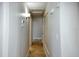 Neutral hallway with tile flooring, a closet and doorways leading to the various rooms of the home at 234 Tait Se Ter, Port Charlotte, FL 33952