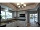 Well-lit kitchen with granite countertops, stainless steel sink and appliances, and a black microwave at 234 Tait Se Ter, Port Charlotte, FL 33952