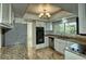 Well-equipped kitchen with granite countertops and stainless steel appliances and a garden view at 234 Tait Se Ter, Port Charlotte, FL 33952