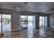Lovely living room boasting tile flooring and sliding glass doors providing stunning views of the pool and canal at 234 Tait Se Ter, Port Charlotte, FL 33952