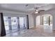 Bright living room with tile flooring and sliding glass doors to the outside area at 234 Tait Se Ter, Port Charlotte, FL 33952