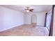Open-concept living room with neutral paint, tile flooring, and a view to another room at 234 Tait Se Ter, Port Charlotte, FL 33952