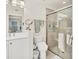 Bright bathroom featuring a glass shower, white vanity, and neutral tile at 240 W End Dr # 312, Punta Gorda, FL 33950