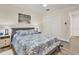 Cozy bedroom with blue and white bedding, wood floors, and natural light at 240 W End Dr # 312, Punta Gorda, FL 33950