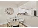 Dining area featuring a marble table and seating for four, with a view into the kitchen at 240 W End Dr # 312, Punta Gorda, FL 33950