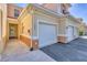 Up close view of a townhome exterior with an attached garage and convenient walkway to the front door at 240 W End Dr # 312, Punta Gorda, FL 33950