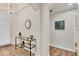 Bright foyer features a decorative mirror and a console table, creating a warm and inviting entrance at 240 W End Dr # 312, Punta Gorda, FL 33950
