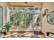 Relaxing screened lanai featuring tile floors and serene views of lush tropical foliage at 240 W End Dr # 312, Punta Gorda, FL 33950