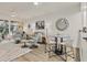 Open concept living room features stylish seating and natural light, perfect for relaxing and entertaining at 240 W End Dr # 312, Punta Gorda, FL 33950