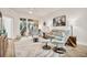 Bright living room featuring a comfortable gray sofa and stylish decor with views of the lanai at 240 W End Dr # 312, Punta Gorda, FL 33950