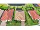 Aerial view of home with tile roof, screened-in pool, and well-maintained landscaping at 24407 Riverfront Dr, Punta Gorda, FL 33980