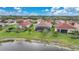 Beautifully landscaped backyard with screened patio and private pond access at 24407 Riverfront Dr, Punta Gorda, FL 33980