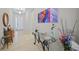 Inviting foyer featuring tile flooring, modern decor, and a glimpse of the open-concept living space at 24407 Riverfront Dr, Punta Gorda, FL 33980