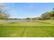 Enjoy serene lake views from this property, enhanced by lush green lawn at 24407 Riverfront Dr, Punta Gorda, FL 33980
